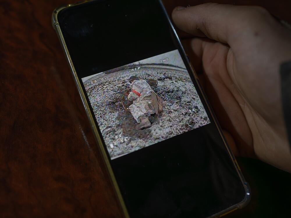 Maksym, 22, an FPV drone operator in Ukraine's military, shows a video of a North Korean soldier targeted by a drone.