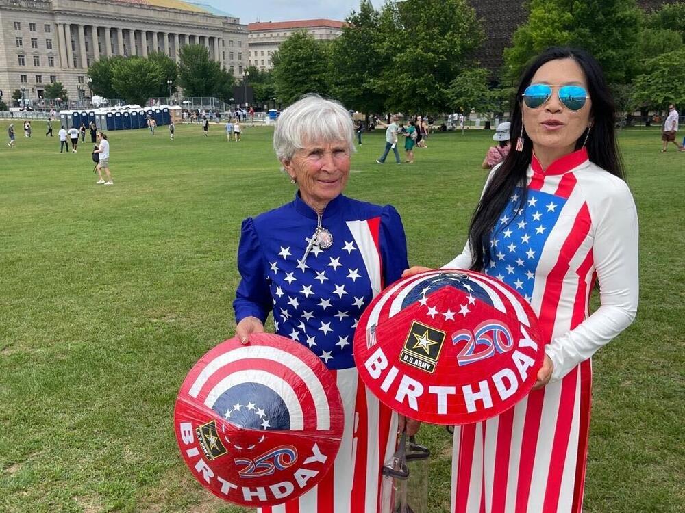 Julianna Balogh (left) and Kim Nguyen are President Trump superfans who traveled from Arkansas and California, respectively, to attend the military parade. Nguyen says her father served with the U.S. Army in South Vietnam and that she came to the U.S. in 1991.