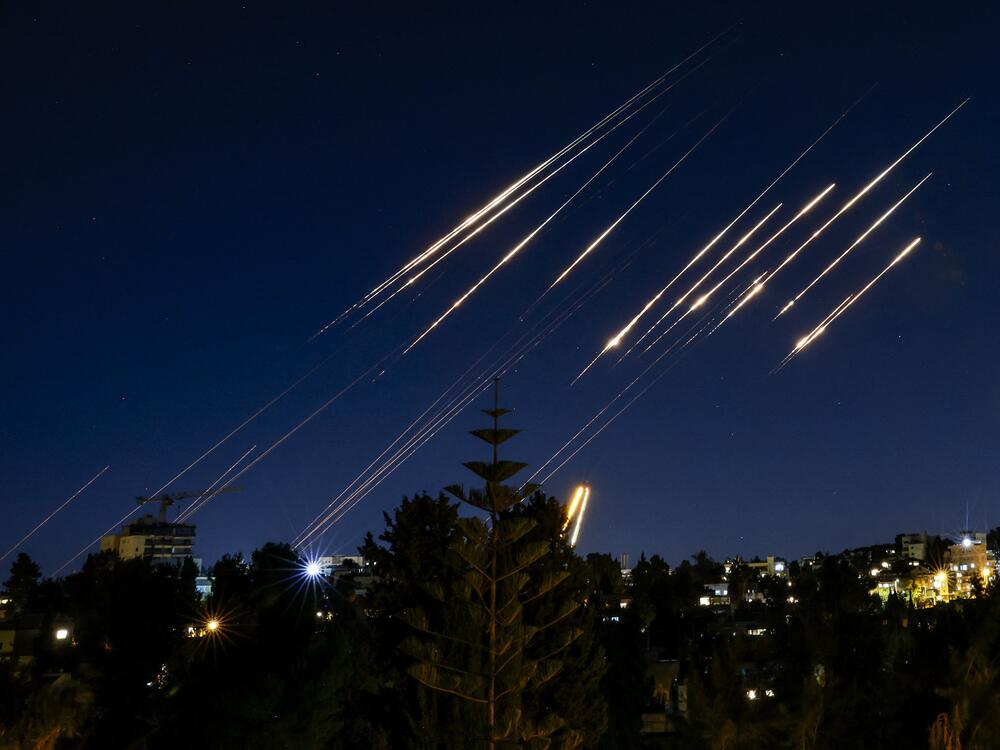 Missiles fired from Iran are pictured in the night sky over Jerusalem on June 14, 2025 as Israel and Iran exchanged fire a day after Israel unleashed an unprecedented aerial bombing campaign that Iran said hit its nuclear facilities, killed top commanders and dozens of civilians.