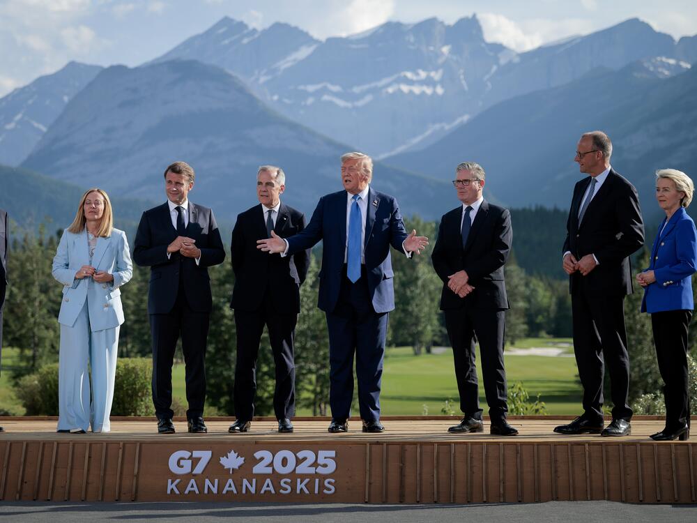 President Trump talks to reporters on June 16, 2025, in Kananaskis, Alberta, Canada, during a 'family photo with G7 leaders (L-R) Japanese Prime Minister Shigeru Ishiba, Italian Prime Minister Giorgia Meloni, French President Emmanuel Macron, Canadian Prime Minister Mark Carney, Trump, British Prime Minister Keir Starmer, German Chancellor Friedrich Merz, and European Union Commission President Ursula von der Leyen.