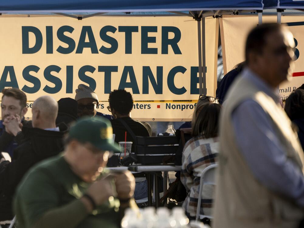People impacted by the wildfires seek information and relief at a FEMA Disaster Recovery Center in 2025, in Pasadena, Calif. The leader of FEMA's top disaster response coordination office has resigned, as President Trump moves to eliminate the agency.