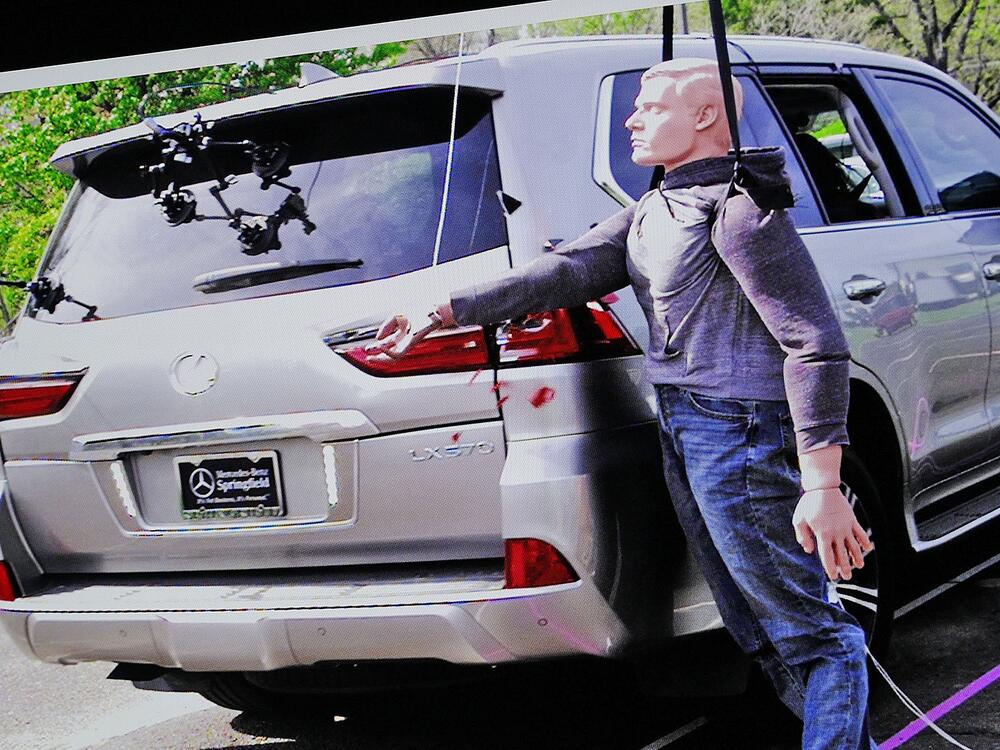 Still images from a reconstruction test show the shattering of an SUV taillight, displayed during the Karen Read retrial in Norfolk Superior Court in June.