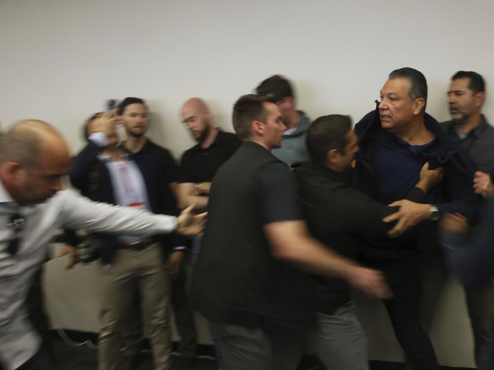 Sen. Alex Padilla, D-Calif., is pushed out of the room as Homeland Security Secretary Kristi Noem holds a news conference regarding the recent protests in Los Angeles on Thursday, June 12.