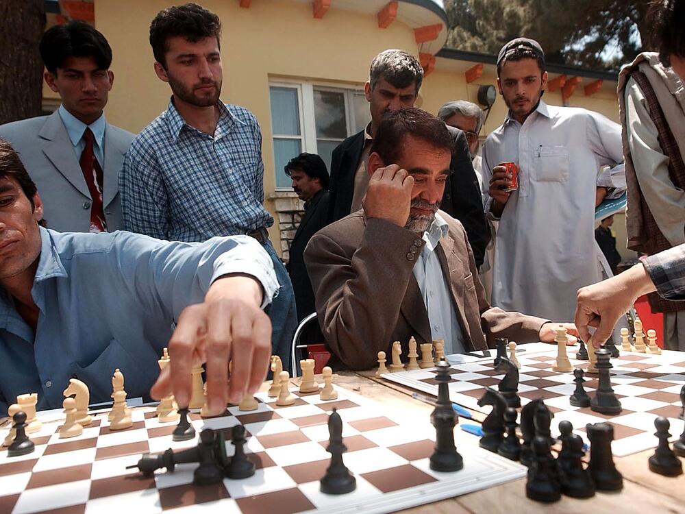 Afghan men play chess at a Kabul tournament held in 2003.