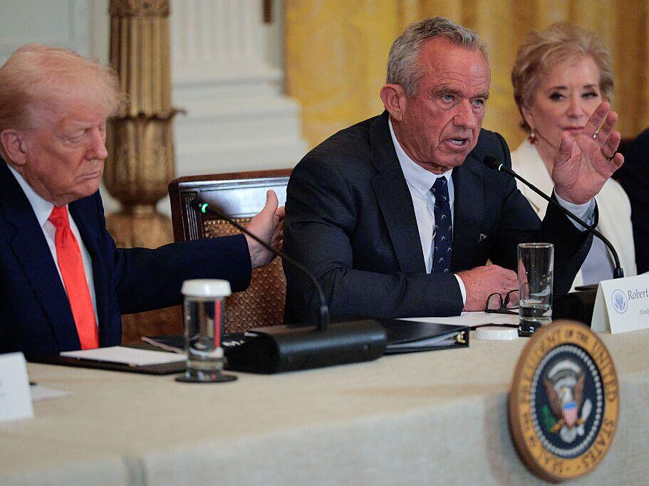 President Trump, Health Secretary Robert F. Kennedy Jr.  and Education Secretary Linda McMahon at an event announcing the release of a Make America Healthy Again Commission report in the East Room of the White House on May 22. Several other members of Trump's Cabinet who served on the commission, including EPA head Lee Zeldin, also attended.