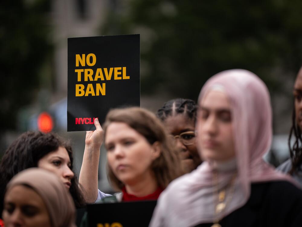 A rally in New York on June 9 protested President Donald Trump's new travel ban, which restricts entry to the United States for citizens from 19 countries.