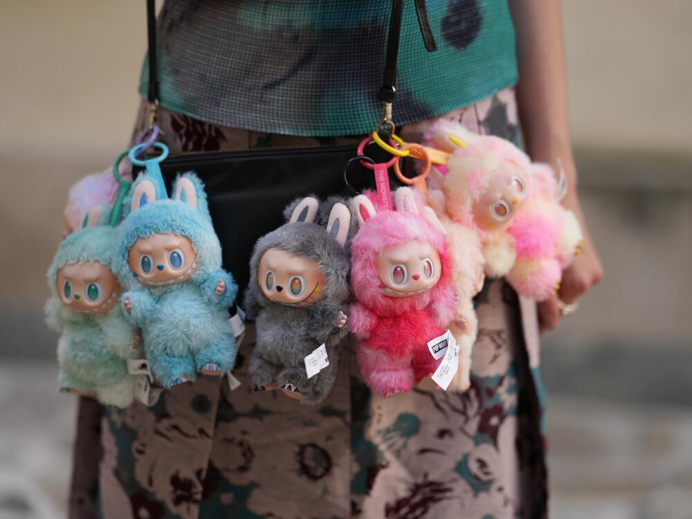 Close-up detail view of seven Labubu monsters during a street style fashion photo session, on June 12 in Paris, France.