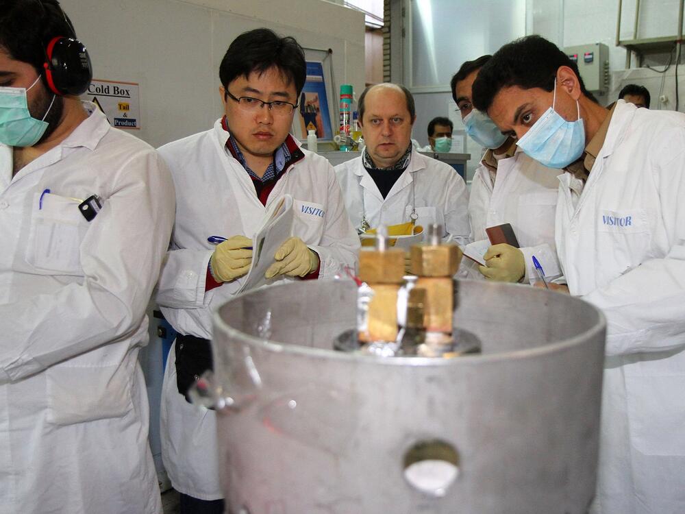 Inspectors from the International Atomic Energy Agency and Iranian technicians work at Iran's Natanz nuclear facility about 200 miles south of Tehran in 2014. Israel has bombed the Natanz facility in recent days.