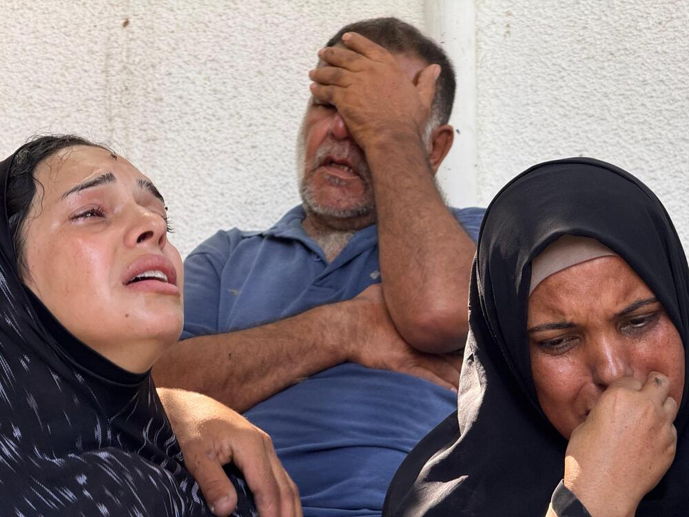 A family mourns a young man killed by Israeli forces while trying to get a sack of flour off U.N. aid trucks entering northern Gaza on Saturday, June, 14, 2025.