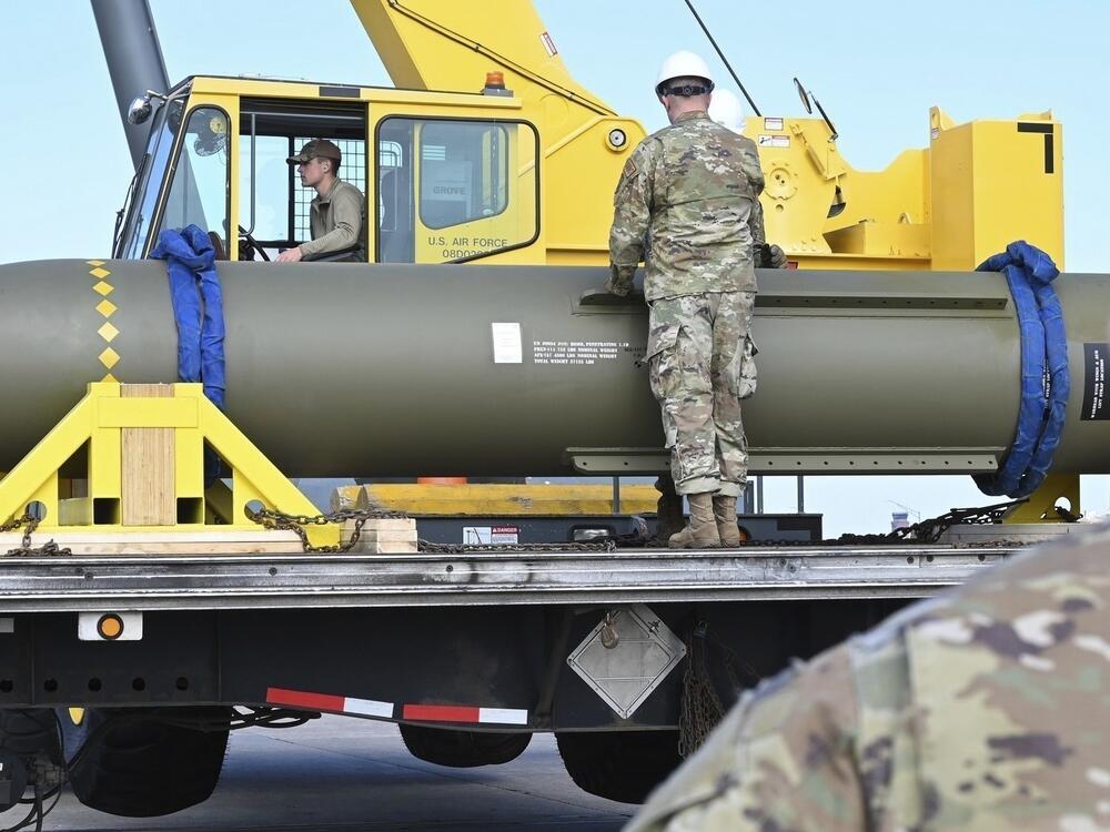 Airmen look at a GBU-57, or a Massive Ordnance Penetrator bomb, at Whiteman Air Force Base in Missouri on May 2, 2023.