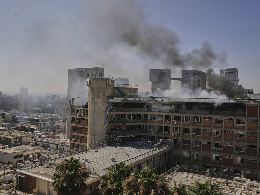 Smokes rises from a building of the Soroka hospital complex after it was hit by a missile fired from Iran in Be'er Sheva, Israel on Thursday.