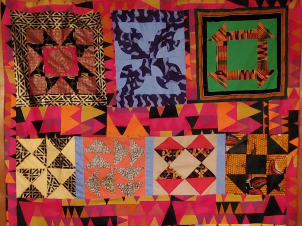 A completed Underground Railroad Code quilt made by Edith Edmunds. The top right block represents the 