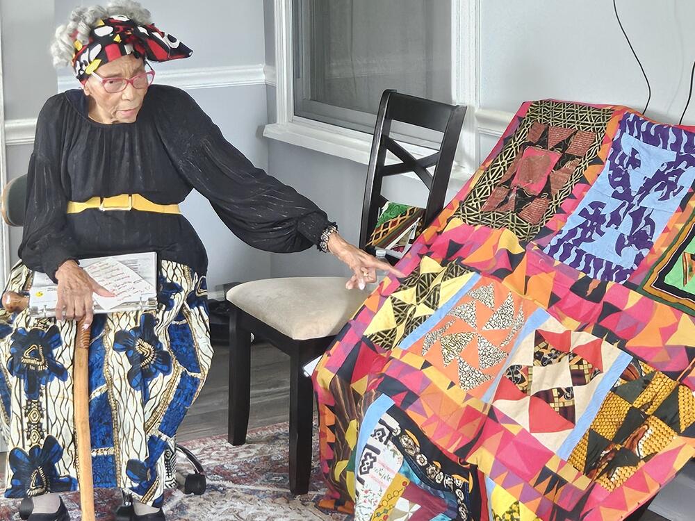 Edith Edmunds, 99, pictured with one of her completed Underground Railroad Code quilts.
