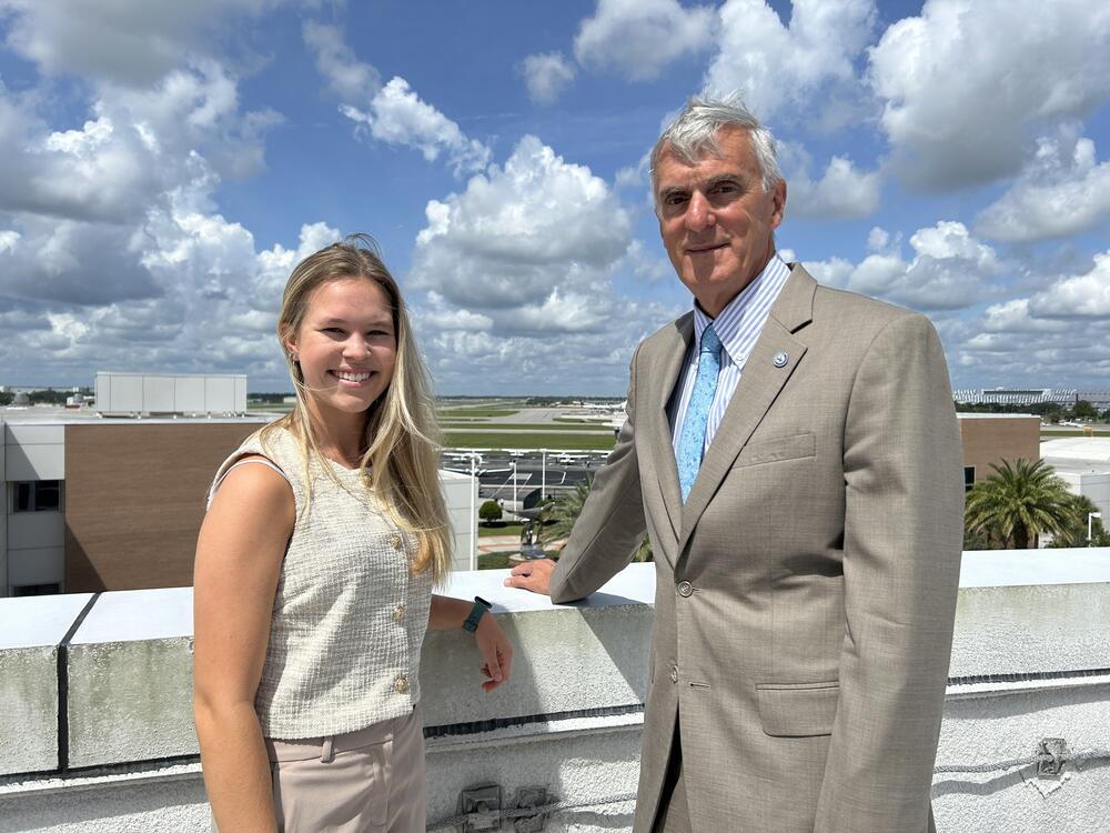 Student Hailee Williamson (left) and Michael McCormick, the head of the air traffic control management program, at Embry-Riddle Aeronautical University. The Daytona Beach International Airport, in the background, is adjacent to the campus.