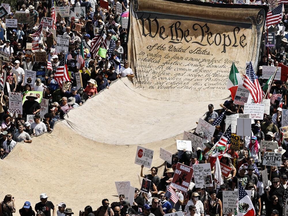 Protesters carry a banner representing the preamble to the U.S. Constitution in downtown Los Angeles during an anti-Trump No Kings Day demonstration on June 14.