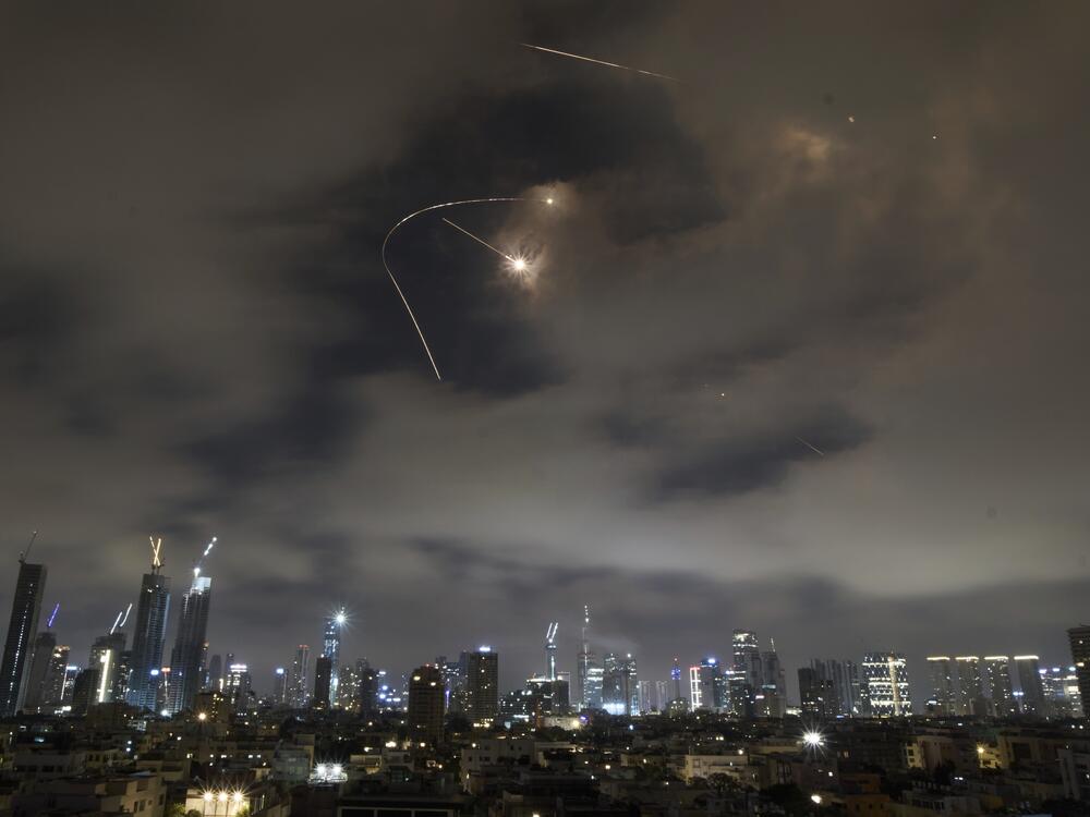 Israeli air defense system fires to intercept missiles during an Iranian attack over Tel Aviv, Israel, Saturday.