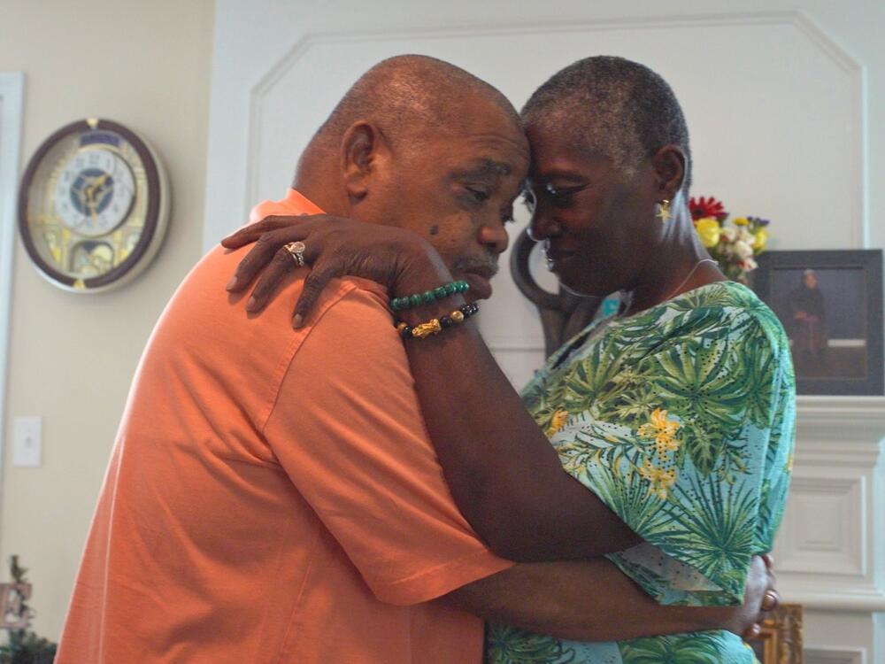 <em>Caregiving</em> traces the history — and unique challenges of — caring for family members in the U.S. In the documentary, viewers meet caregivers like Malcoma Brown-Ekeogu, who now helps her husband, Kenneth, with even his most basic needs, like walking and bathing. 