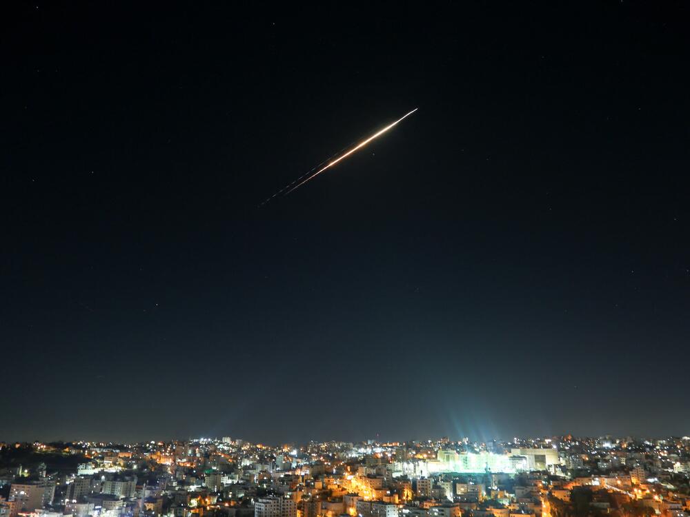 Iranian missiles aimed at targets in Israel pass through the sky of Hebron, West Bank on June 18 as Israeli air defense system tries to intercept them.