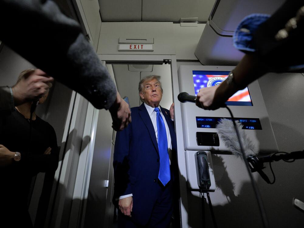 President Trump talks to reporters on board Air Force One on Monday. Historically, he has promised action or answers within two weeks, as is the case with a decision about U.S. involvement in the Israel-Iran conflict.