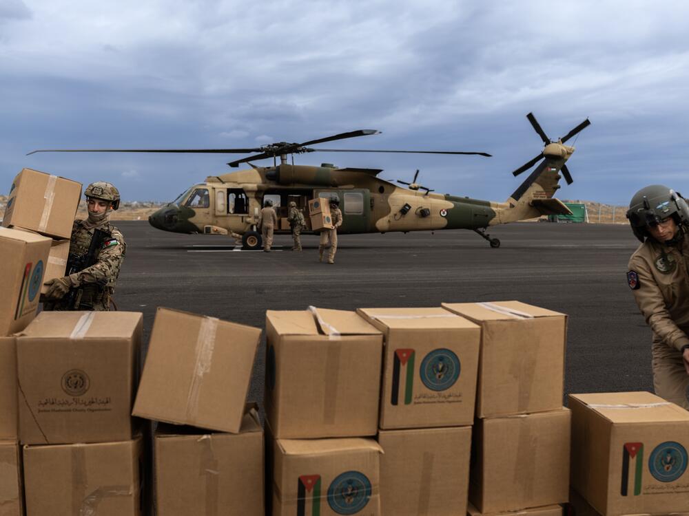 The Royal Jordanian Air Force's 8th Squadron unloads humanitarian aid at a helipad on the outskirts of Gaza, on Feb. 9.