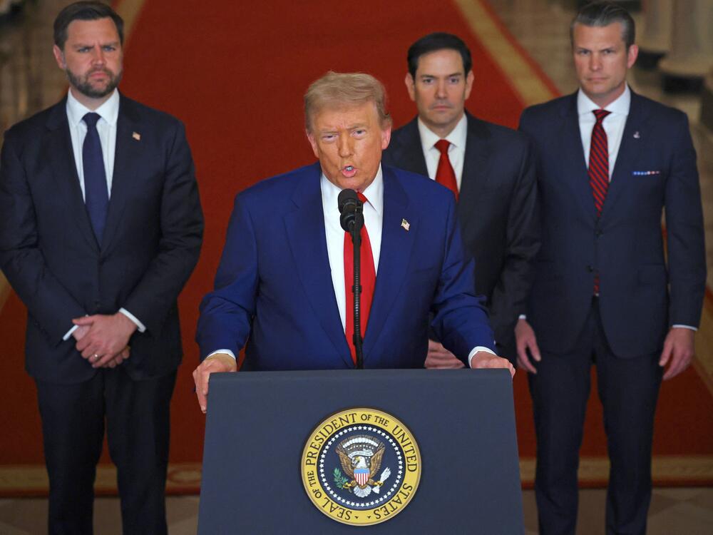 President Trump addresses the nation, alongside (from left) Vice President Vance, Secretary of State Marco Rubio and Secretary of Defense Pete Hegseth, from the White House on Saturday.