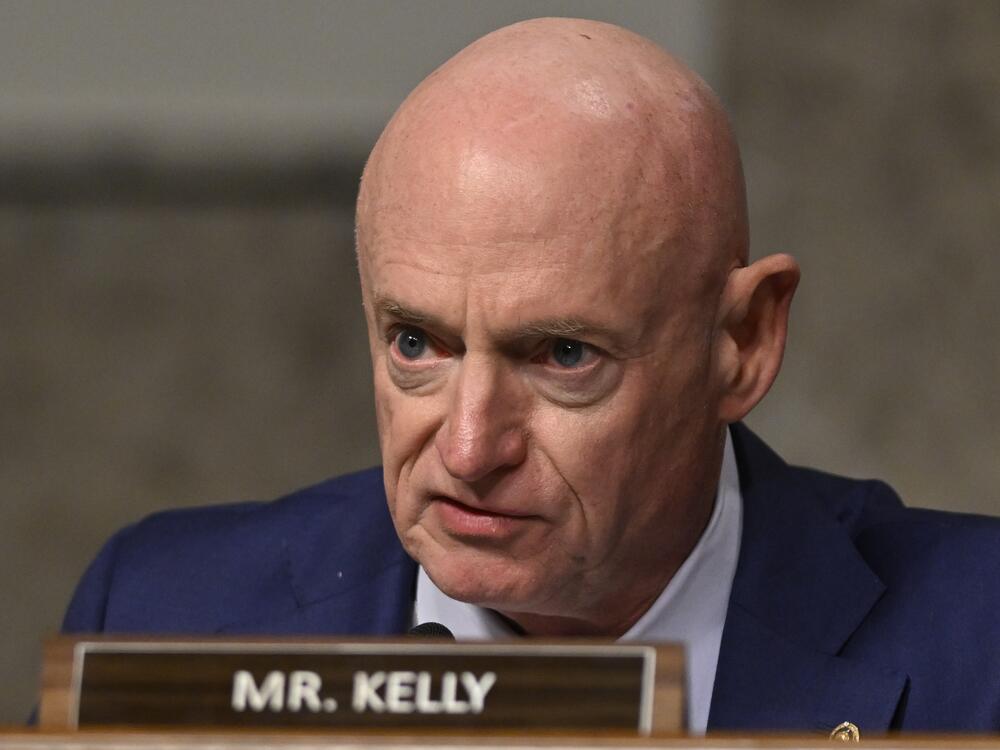 Sen. Mark Kelly, D-Ariz., questions John Ratcliffe, President-elect Donald Trump's choice to be the Director of the Central Intelligence Agency, appearing before the Senate Intelligence Committee for his confirmation hearing, at the Capitol in Washington, Wednesday, Jan. 15, 2025. (AP Photo/John McDonnell)