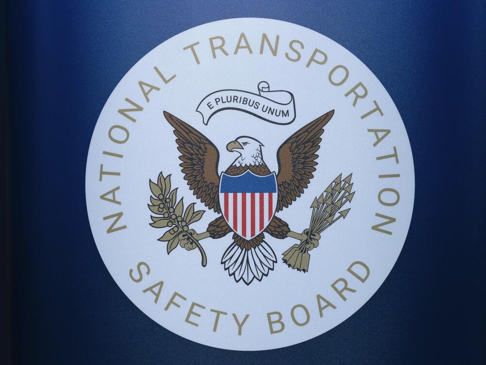 The seal of the National Transportation Safety Board is seen before a news conference at Ronald Reagan Washington National Airport on Jan. 31. The pilot of a small plane that crashed near a North Carolina airport this month had raised a wheel after landing to avoid hitting a turtle on the runway, according to a preliminary report by the NTSB.