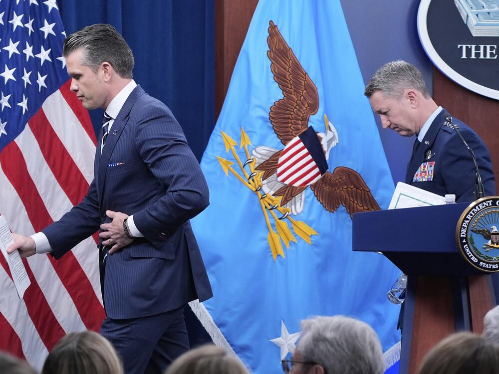Defense Secretary Pete Hegseth and Joint Chiefs Chairman Gen. Dan Caine depart at the end of a news conference at the Pentagon in Washington, Sunday, June 22, after the U.S. military struck three sites in Iran, directly joining Israel's effort to destroy the country's nuclear program.