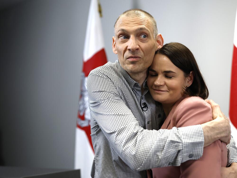 Syarhei Tsikhanouski, left, Belarusian opposition activist released from a Belarusian prison, embraces his wife, Belarusian opposition leader Sviatlana Tsikhanouskaya, after a news conference in Vilnius, Lithuania, Sunday, June 22, 2025.