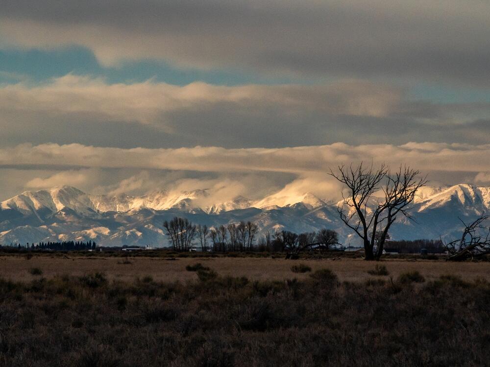The Sangre de Cristo mountains loom over Colorado's San Luis Valley. Many in this agricultural region voted for President Trump and are deeply concerned about cuts to Medicaid.