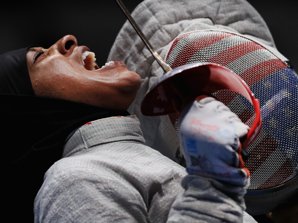 Ibtihaj Muhammad of the United States reacts against Sofya Velikaya of Russia during the Women's Sabre Team Semifinal 1 Russia vs United States at Carioca Arena 3 on August 13, 2016 in Rio de Janeiro, Brazil. (Photo by Tom Pennington/Getty Images)
