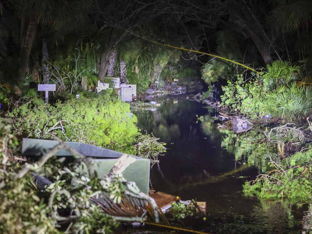 Debris along Commonwealth Drive clogs the roadway after Hurricane Milton made landfall nearby Thursday, Oct. 10, 2024 in Siesta Key, Fla.