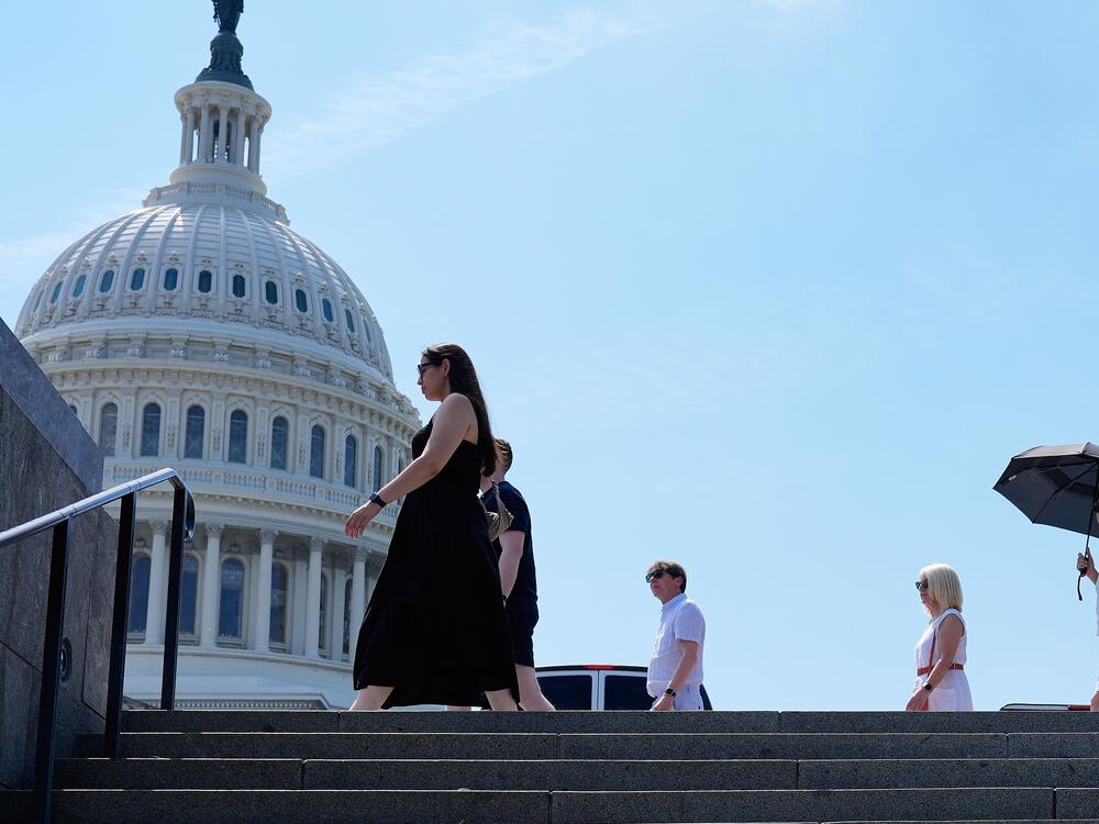 People walk in front of the U.S Capitol, Tuesday, June 24, 2025. The East Coast and much of the Midwest are experiencing the first major heat wave of the year.