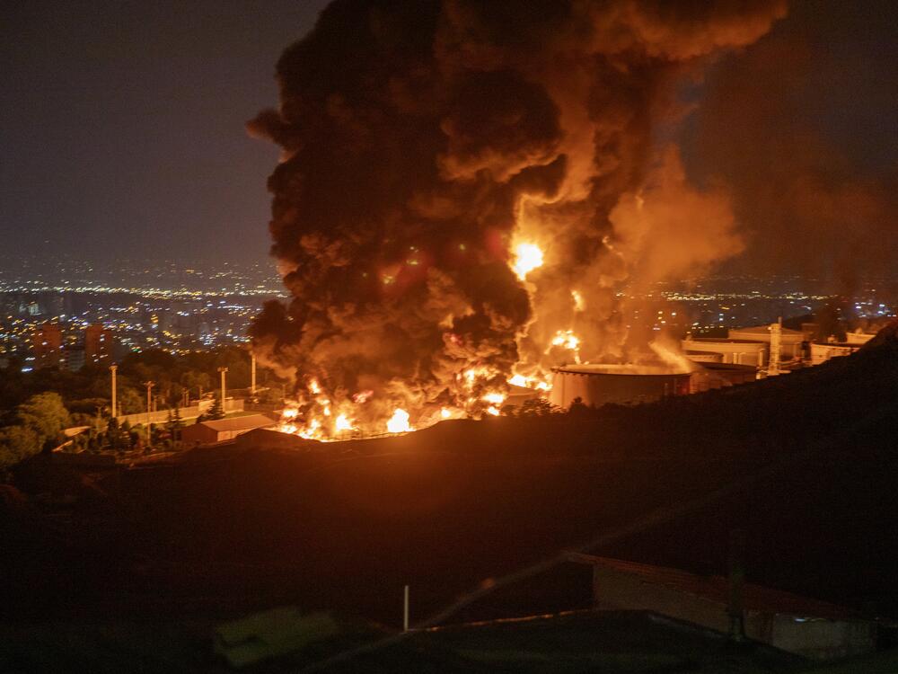 Fire and smoke rise after an Israeli attack on the Shahran oil depot on June 15 in Tehran, Iran.