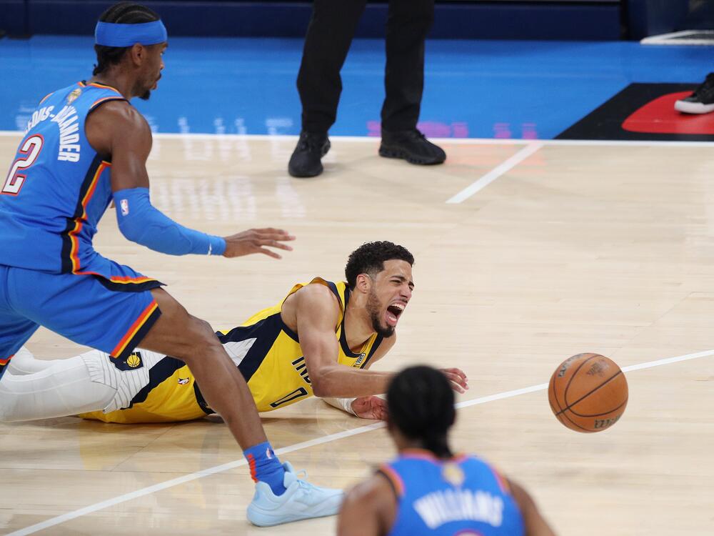 Tyrese Haliburton of the Indiana Pacers tumbles to the floor after sustaining an Achilles injury during the first quarter against the Oklahoma City Thunder in Game Seven of the 2025 NBA Finals on Sunday in Oklahoma City. Haliburton limped off the court and did not return.