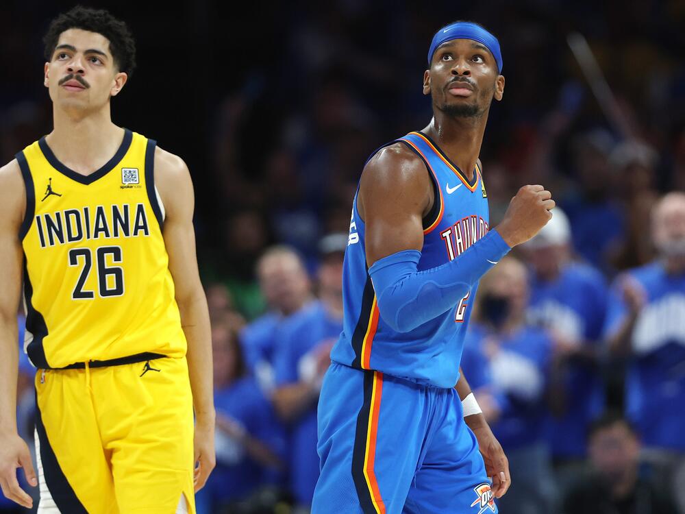 Shai Gilgeous-Alexander (r) of the Oklahoma City Thunder celebrates as Ben Sheppard of the Indiana Pacers looks on during the fourth quarter in Game 7 of the 2025 NBA Finals on Sunday in Oklahoma City. Gilgeous-Alexander, who scored 29 points and added 12 assists, was named the series MVP. He's the first player in 25 years to win the league MVP, the scoring title and the Finals MVP.