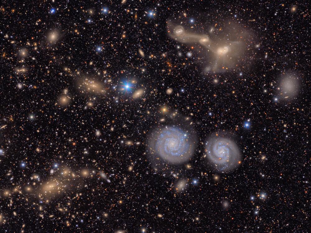 This image shows another small section of NSF-DOE Vera C. Rubin Observatory's total view of the Virgo cluster. Visible are two prominent spiral galaxies (lower right), three merging galaxies (upper right), several groups of distant galaxies, many stars in the Milky Way galaxy and more.