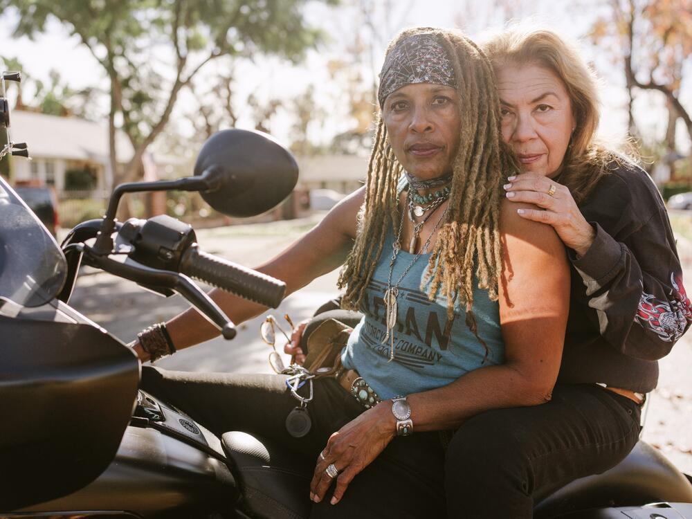 Gevin Fax (left) and Cathy Tangum pose for a portrait on Gevin's motorcycle in front of their home in Van Nuys, Calif.