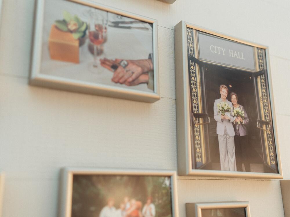 A photo of Nanette and Dee getting married at San Francisco City Hall hangs on a wall in their home in San Francisco.