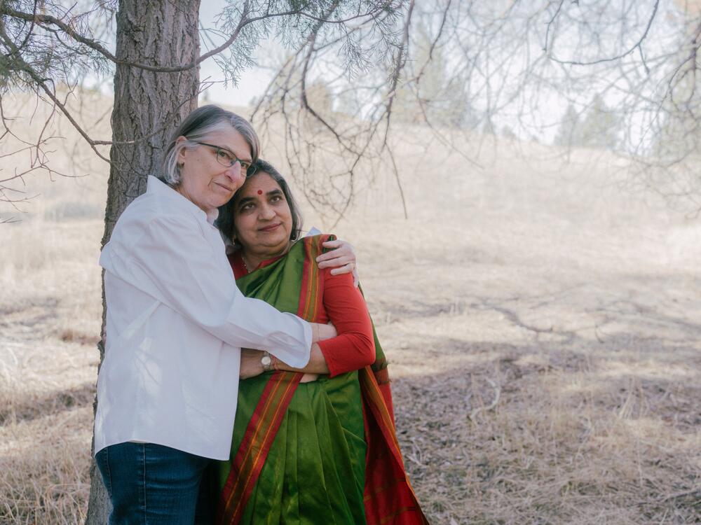 Mona Bachmann (left) holds Ruth Vanita in their backyard of their home in Missoula, Mont.