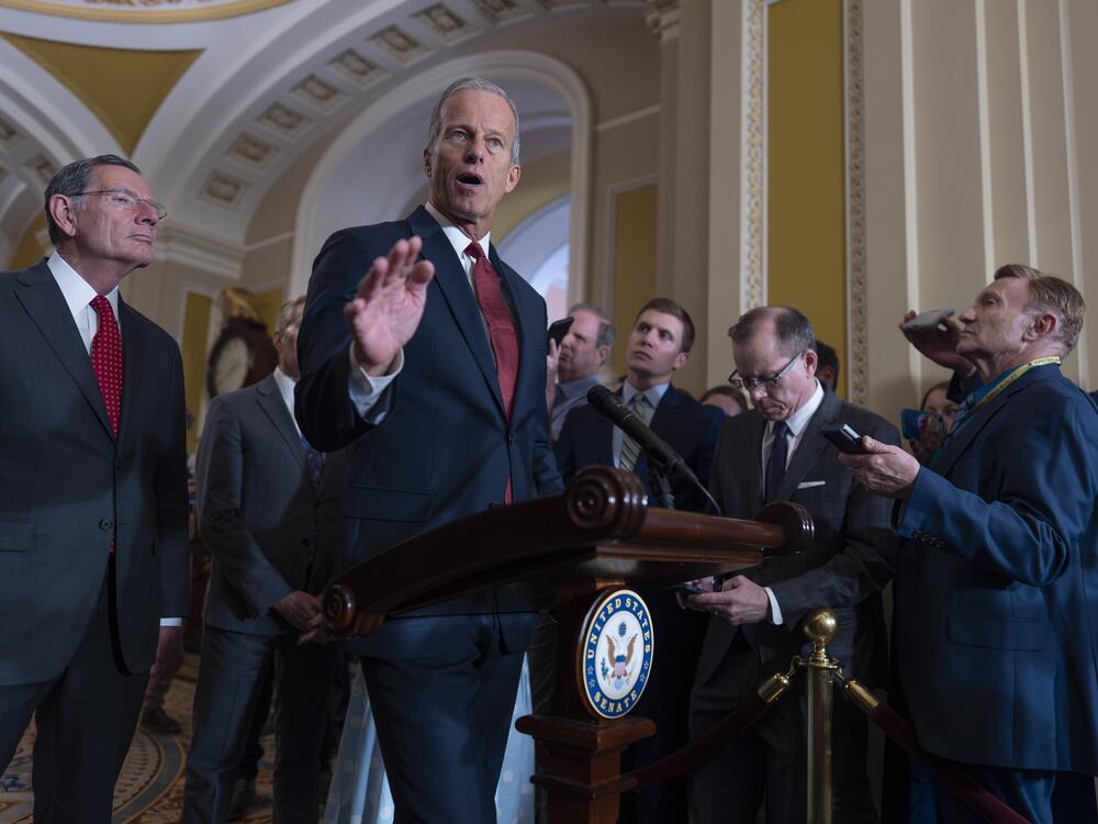 Senate Majority Leader John Thune, R-S.D., center, speaks to reporters after GOP lawmakers met with Treasury Secretary Scott Bessent on Tuesday to discuss the sweeping tax and spending bill Republicans are hoping to have to President Trump by July 4.