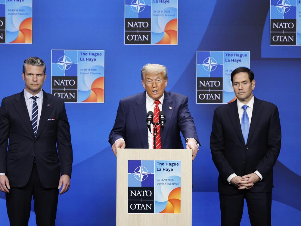 President Donald Trump, center, speaks during a media conference at the NATO summit in The Hague, Netherlands, Wednesday, June 25, 2025.