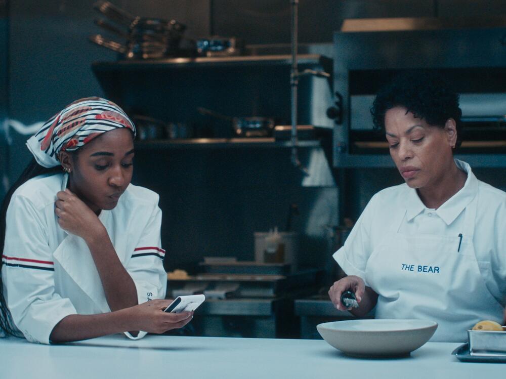 Ayo Edebiri as Sydney Adamu and Liza Colón-Zayas as Tina Marrero.