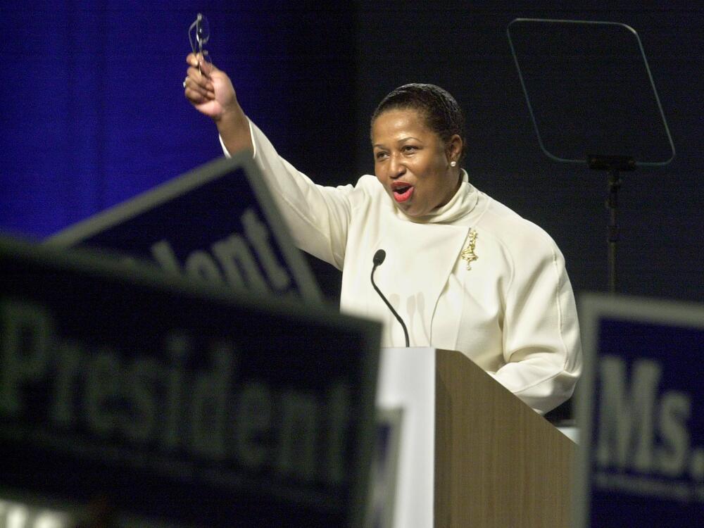 Democratic presidential candidate, former Illinois Sen. Carol Moseley Braun waves to sign waving supporters during her speech at the California Democratic Party State Convention in Sacramento, Calif., Sunday, March 16, 2003.