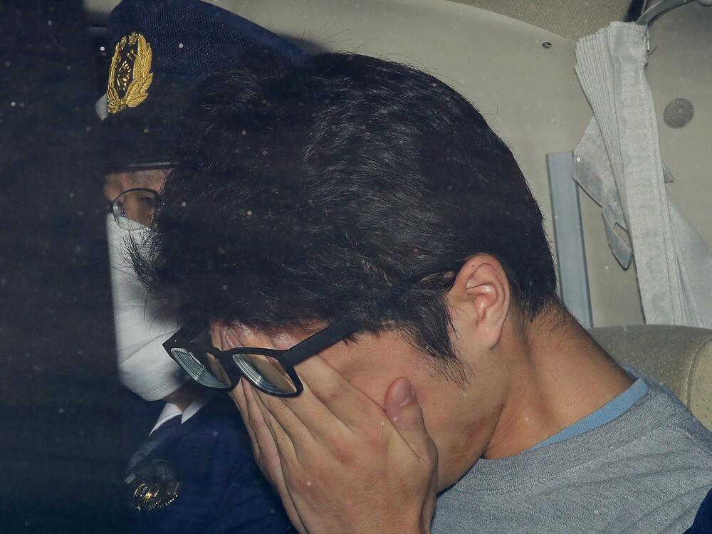 FILE - Takahiro Shiraishi leaves a police station in Hachioji, suburbs of Tokyo, in November 2017.