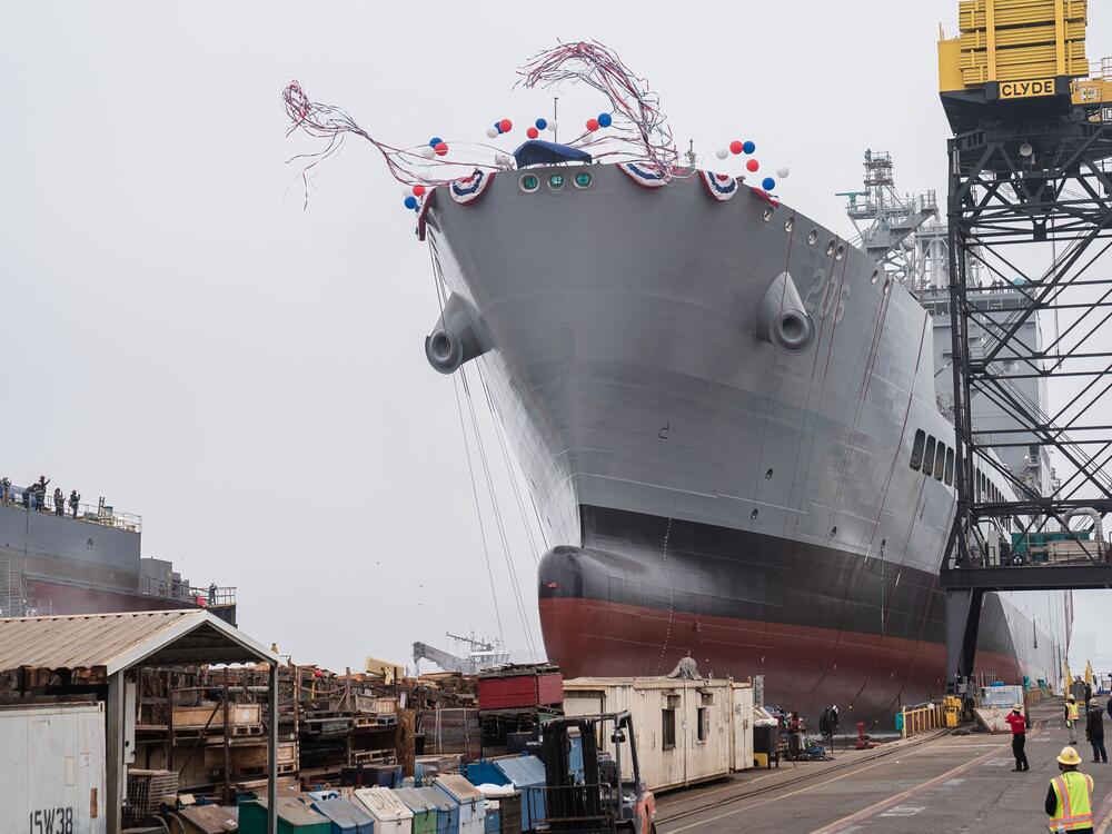 The USNS Harvey Milk departs the General Dynamics NASSCO shipyard after a christening ceremony in San Diego, on Nov. 6, 2021. The ship has been renamed the USNS Oscar V. Peterson, after a World War II naval officer, Secretary of Defense Pete Hegseth announced Friday.
