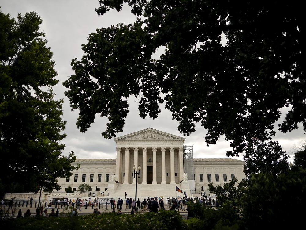 People gather outside the U.S. Supreme Court.