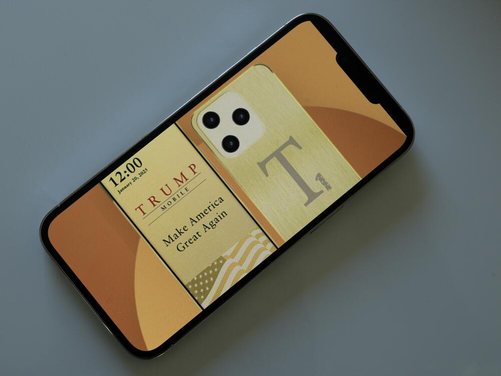 In this photo illustration, an iPhone displays the website for The Trump Organization's mobile phone service and a Trump-branded smartphone on June 16. According to the website, Trump Mobile offers both a cellular plan and a smartphone that will provide the same coverage as the three nationwide phone service carriers.