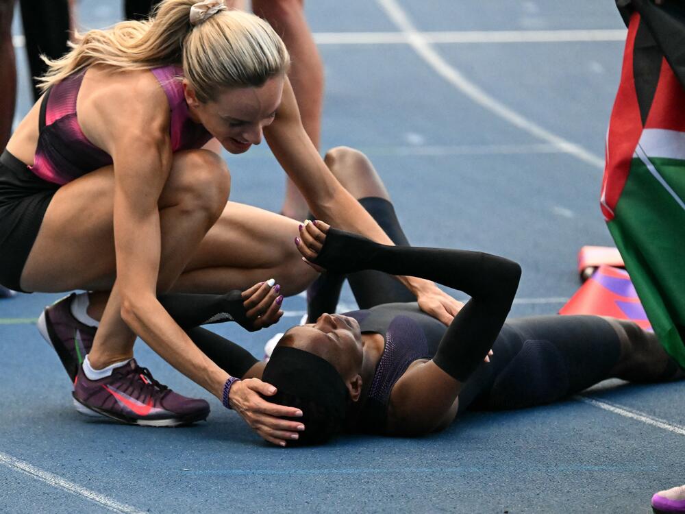 Kenya's Faith Kipyegon reacts at the end of her race after taking part in the 