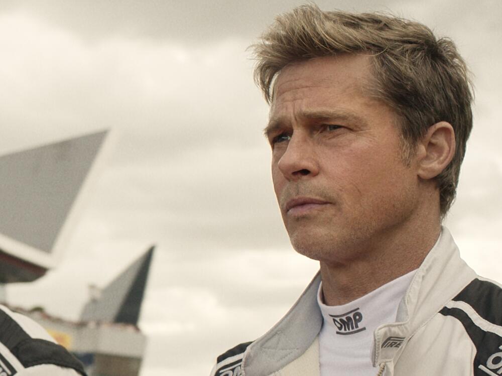 Damson Idris as Joshua Pearce and Brad Pitt as Sonny Hayes in <em>F1</em>.